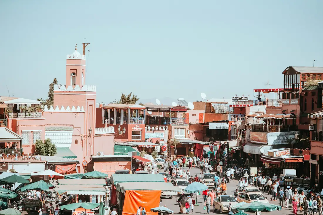 Marrakech medina rooftops with the Atlas Mountains beyond, close to Morocco Quest's sustainable venues