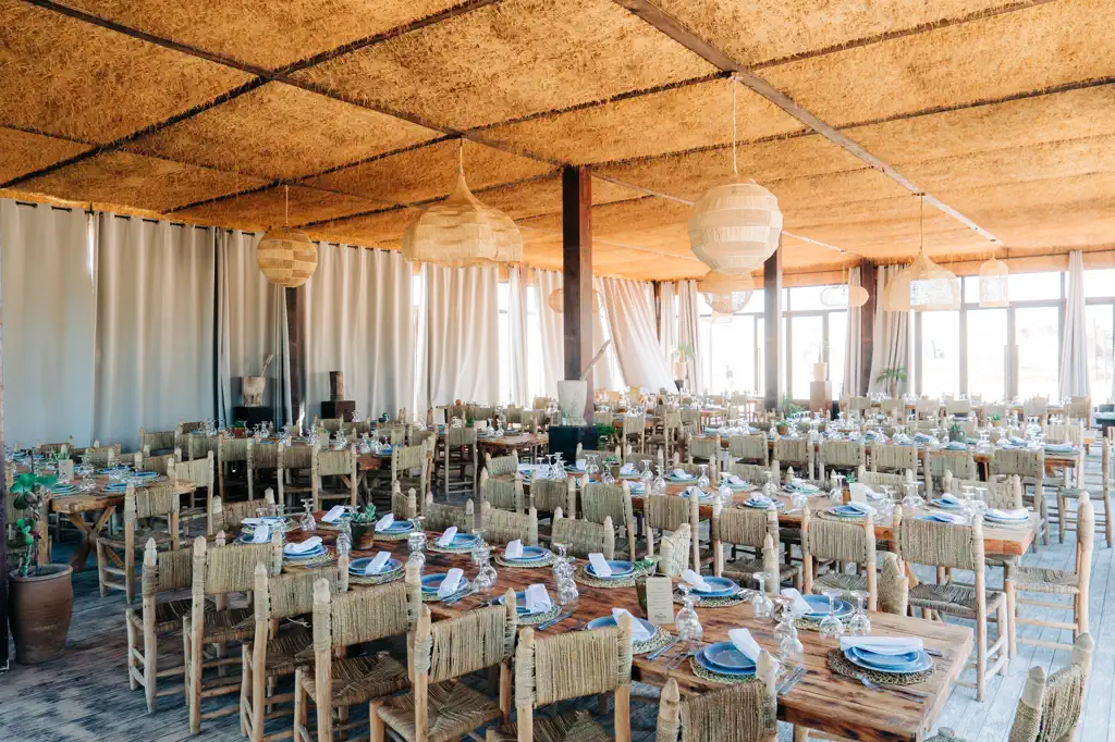 Rustic banquet dining with natural materials at a sustainable Morocco Quest event in Morocco