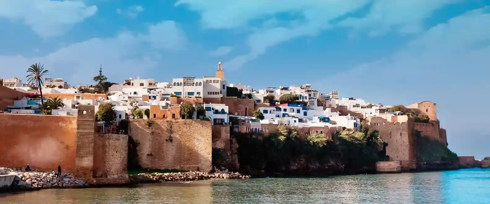 Breathtaking panoramic vista of the historic Oudayas Kasbah overlooking the Bou Regreg River and the Atlantic Ocean, showcasing Rabat’s blend of ancient architecture and coastal beauty.