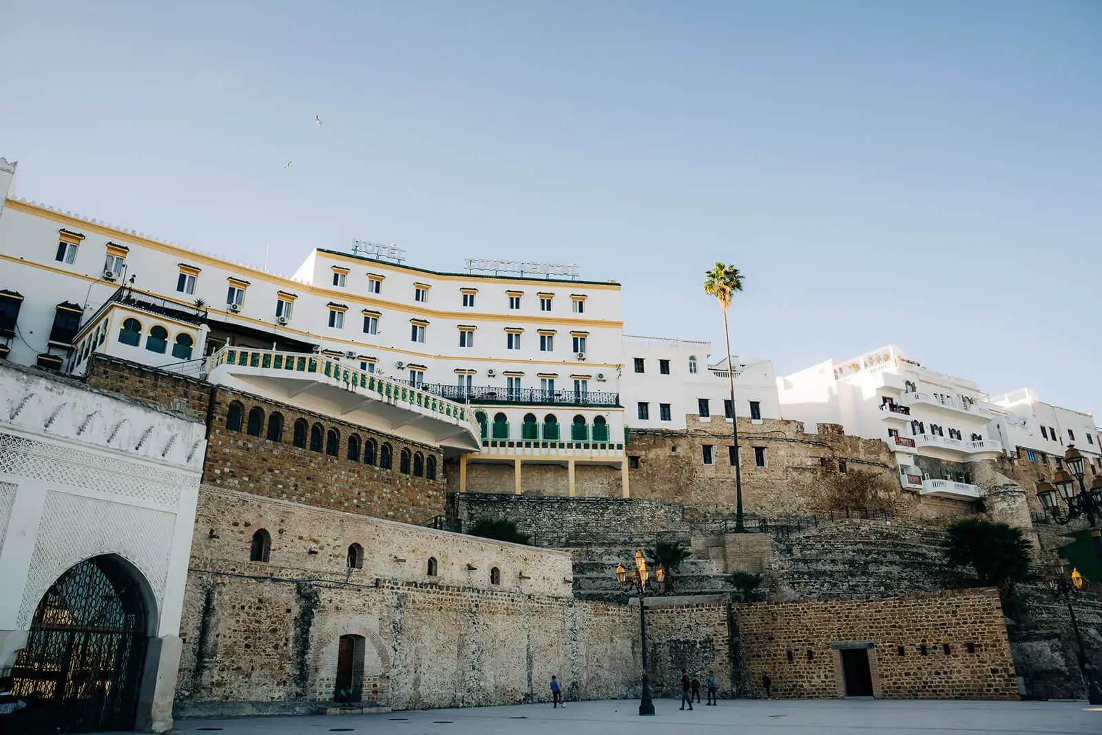 Breathtaking panoramic view from Tangier’s historic Kasbah, showcasing the vibrant medina, bustling harbor, and the sparkling waters of the Strait of Gibraltar.